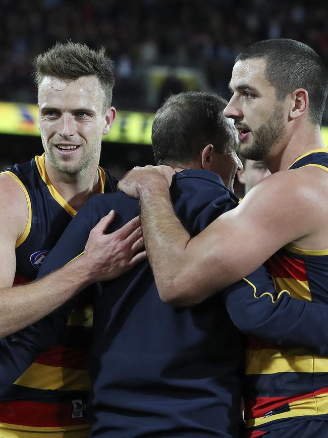 Brodie Smith and Taylor Walker hug Don Pyke after the win. Picture SARAH REED