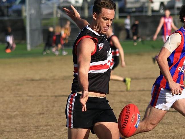 Jarrod Wright gets a kick away. Picture: Davis Harrigan