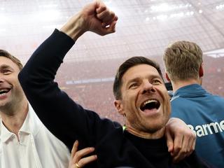 Xabi Alonso celebrates after guiding Bayer Leverkusen to its first Bundesliga title. (Photo by Lars Baron/Getty Images)
