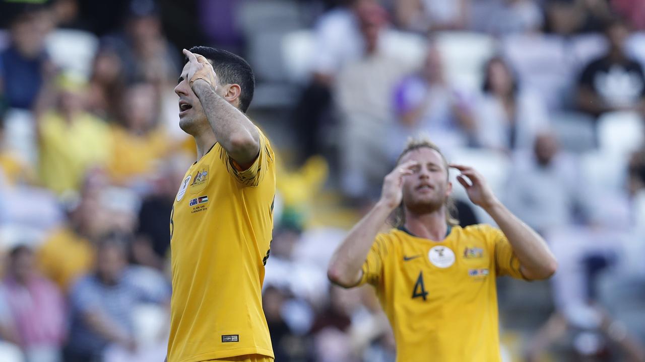 Australia's midfielder Tomas Rogic, left, and teammate Ryan Grant