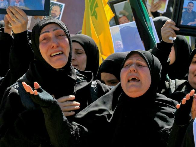 Women mourn during the funeral on February 28, 2025 of 95 Hezbollah fighters and civilians killed in Israeli airstrikes. Picture: AFP