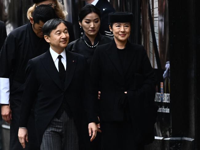 Japan's Emperor Naruhito and his wife Empress Masako arrive at Westminster Abbey in London on September 19, 2022, for the State Funeral Service for Britain's Queen Elizabeth II. - Leaders from around the world will attend the state funeral of Queen Elizabeth II. The country's longest-serving monarch, who died aged 96 after 70 years on the throne, will be honoured with a state funeral on Monday morning at Westminster Abbey. (Photo by Marco BERTORELLO / AFP)