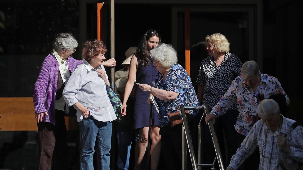 Susan Neill-Fraser’s daughter, Sarah Bowles, flanked by supporters of her mother outside the Supreme Court of Tasmania in 2018. Picture: Luke Bowden