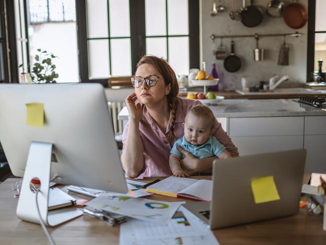 Mother with her baby boy working from home in days of isolation istock picture.