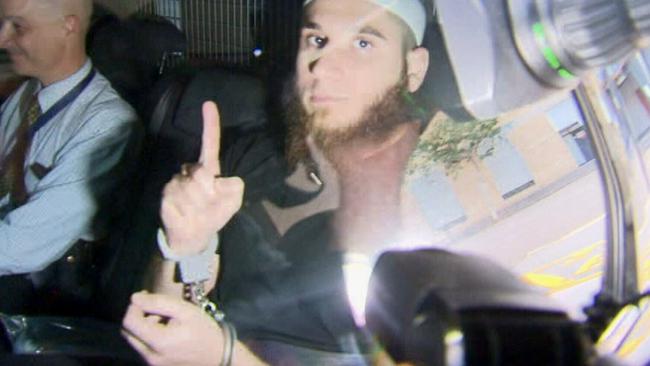 Qazim Kruezi’s older brother Agim Kruezi is taken to the Brisbane watch-house after being arrested during terror raids. Picture: Nine News