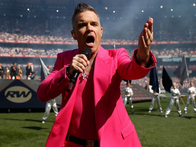 MELBOURNE, AUSTRALIA - SEPTEMBER 24: Robbie Williams performs during the 2022 Toyota AFL Grand Final match between the Geelong Cats and the Sydney Swans at the Melbourne Cricket Ground on September 24, 2022 in Melbourne, Australia. (Photo by Michael Willson/AFL Photos via Getty Images)