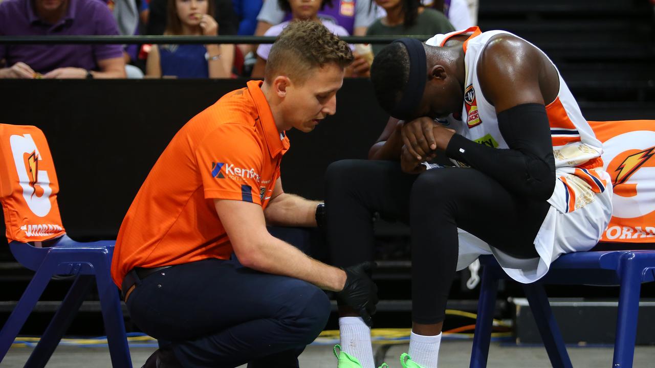 SYDNEY, AUSTRALIA – MARCH 21: Kouat Noi of the Taipans receives attention after sustaining an injury during the NBL match between the Sydney Kings and the Cairns Taipans at Qudos Bank Arena on March 21, 2021, in Sydney, Australia. (Photo by Jason McCawley/Getty Images)