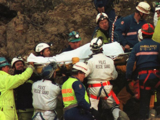 Diver is carefully removed from the rubble.