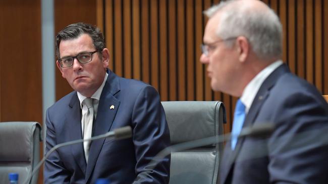 CANBERRA, AUSTRALIA - DECEMBER 11: Australian Prime Minister Scott Morrison (right) together with State Premiers Annastacia Palaszczuk (left), Daniel Andrews (centre) address the media in the Main Committee Room at Parliament House, on December 11, 2020 in Canberra, Australia. Australia's leaders are meeting face to face for the first time in nine months, after Prime Minister Scott Morrison convened 32 virtual meetings of the National Cabinet with premiers and chief ministers since March to coordinate responses to COVID-19. (Photo by Sam Mooy/Getty Images)