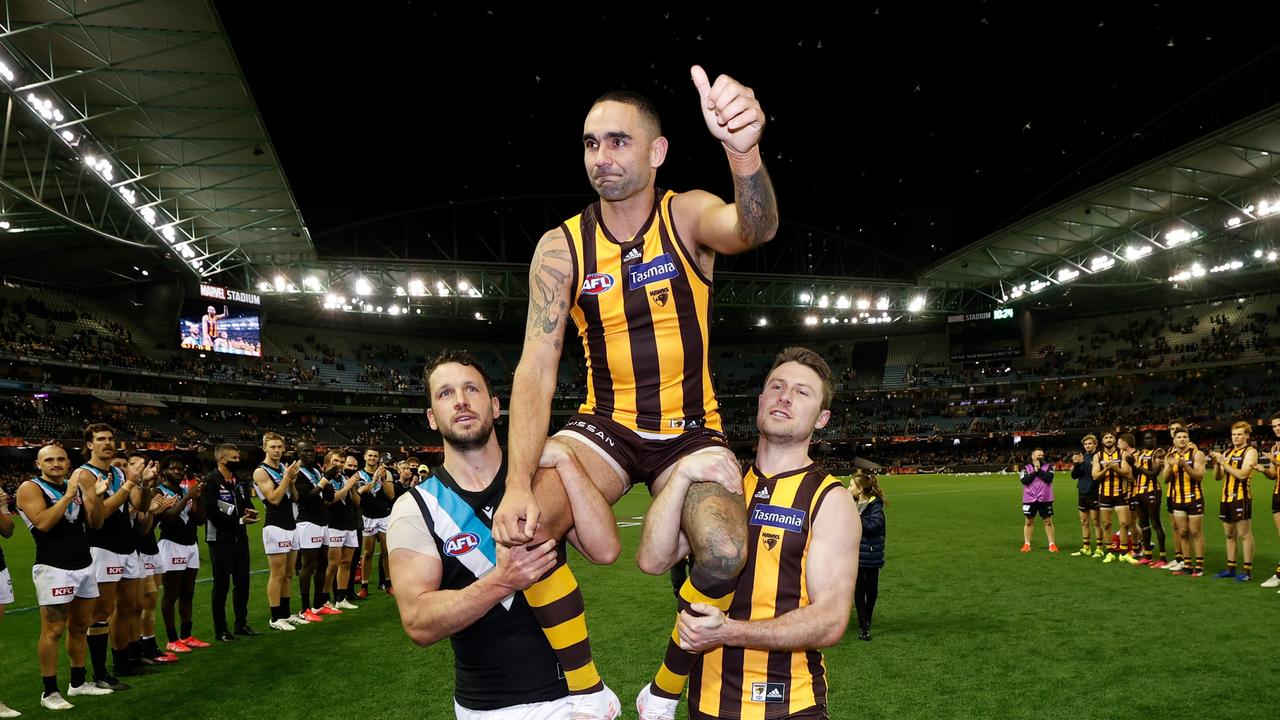 Shaun Burgoyne being chaired off by Travis Boak and Liam Shiels. Picture: Michael Willson/AFL Photos via Getty Images