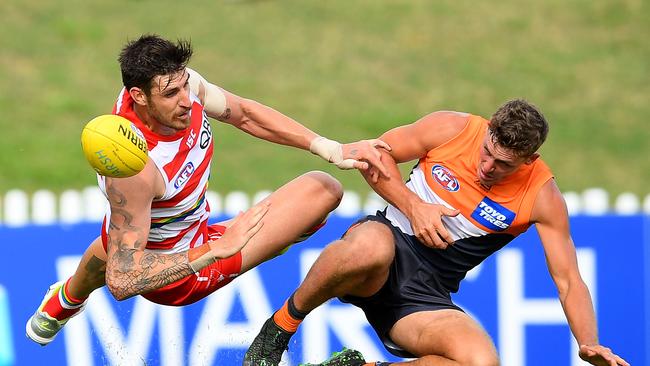 Riverina’s Harry Perryman, from the Giants, contests with Sam Naismith of the Swans for the ball during an AFL Marsh Community Series pre-season match in Sydney on February 29. Picture: AAP/Dan Himbrechts