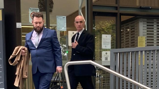 Andrew Ralston (right) leaves Queanbeyan Court with lawyer Luke Vozella (left) on May 11, 2022. Picture: Julia Kanapathippillai