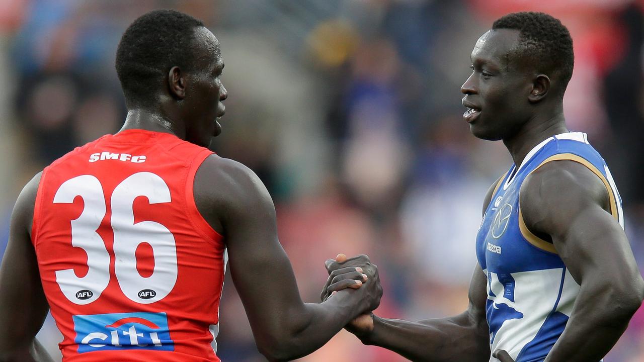 Aliir Aliir of the Swans and Majak Daw of the Kangaroos. (Photo by Darrian Traynor/Getty Images)