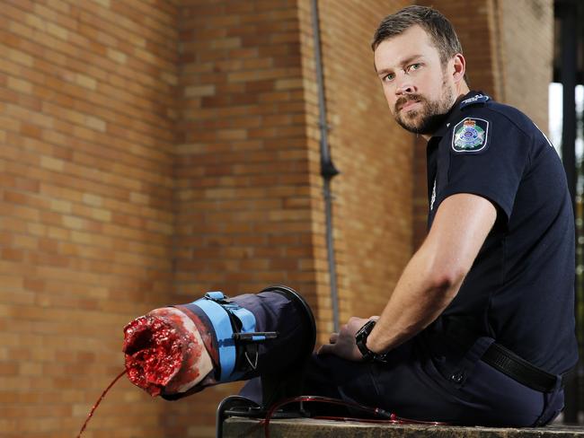 Senior Constable Dustin Osborne at the Police Training Facility in Red Hill, Brisbane. More than 11,000 operational Queensland Police Officers have now been trained in Tactical First Aid. Picture: Josh Woning/AAP