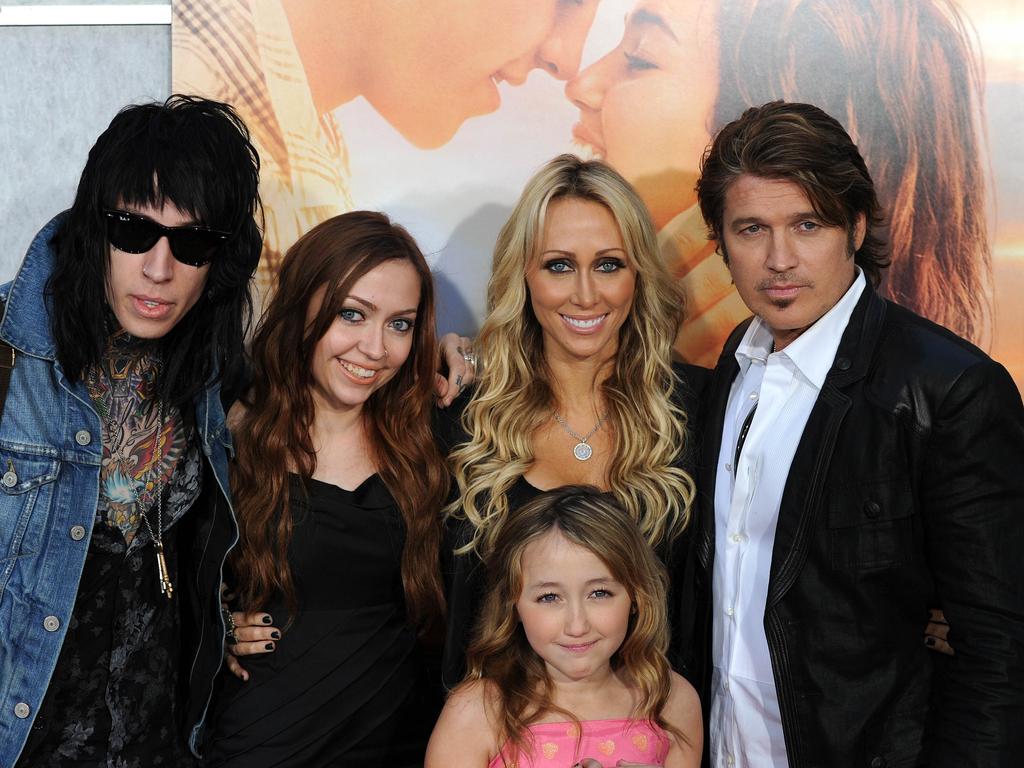 Trace Cyrus (far left) with sisters, Brandi Cyrus, Noah Cyrus, mum Tish Cyrus, and dad Billy Ray Cyrus in 2010, urged his father to “get help”. Picture: AFP