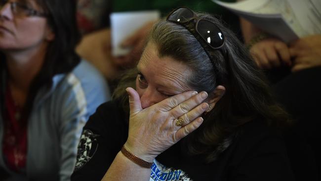 A resident in the fire zone was overcome with emotion at the meeting in Lancefield.