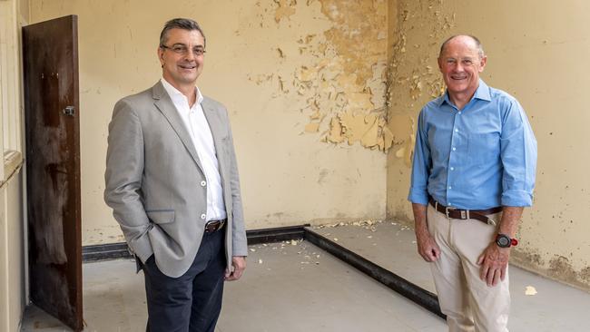 PwC managing partner and Sydney Harbour Federation Trust chairman Joseph Carrozzi, left, at the old school of artillery on North Head with its former commanding officer john Platt. Picture: NCA NewsWire/ Monique Harmer