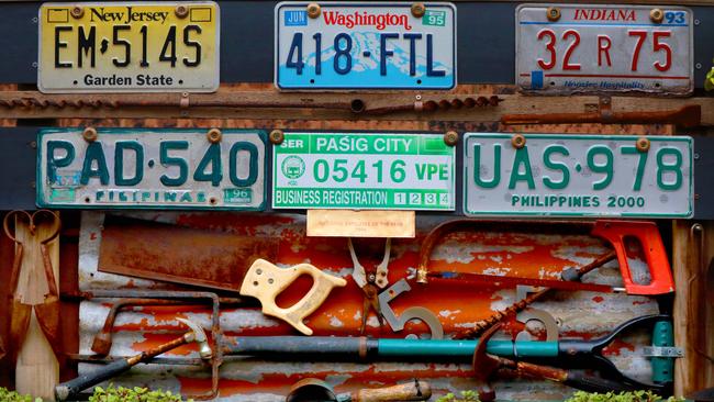 Licensed to garden: Numberplates from around the globe have made their way to Orlando‘s garden. Picture: Angelo Velardo