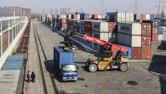 A mobile crane moves a container at a logistic station in Shenyang, in China’s Liaoning Province Picture: AP)