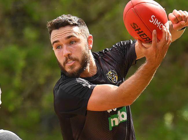 GOLD COAST, AUSTRALIA - SEPTEMBER 11: Shane Edwards of the Tigers handballs whilst being tackled during his period in the AFL quarantine hub at the Mercure on September 11, 2020 in Gold Coast, Australia. (Photo by Quinn Rooney/Getty Images)