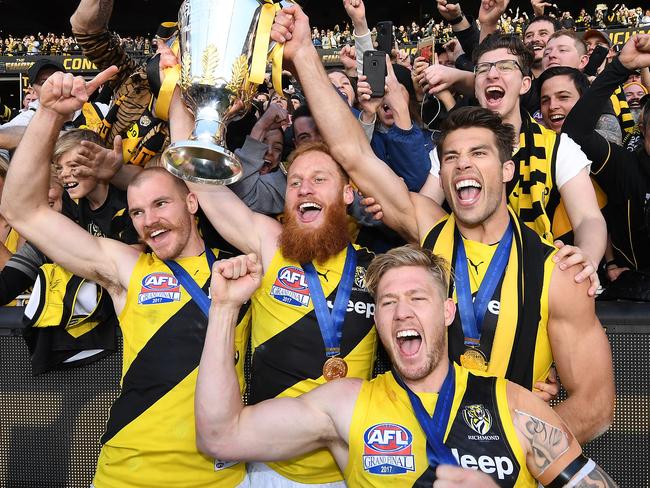 Kamdyn McIntosh, Nick Vlastuin, Nathan Broad and Alex Rance celebrate with fans after the 2017 premiership win. Picture: AAP