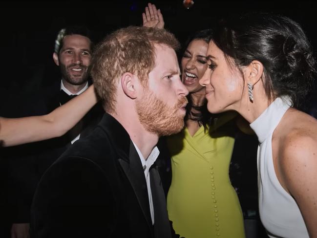 Darren Litt and Janina Gavankar can be seen in the background as Prince Harry busts a move. Picture: Netflix