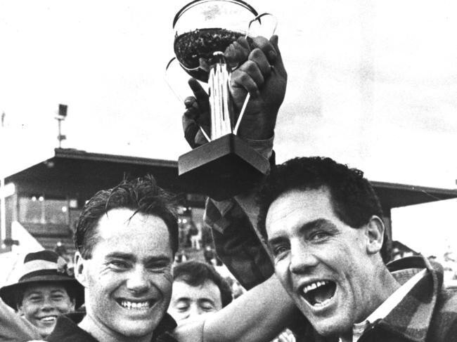 Newtown &amp; Chilwell captain Basil Flynn and coach Kevin Higgins celebrate the 1986 GFL premiership.