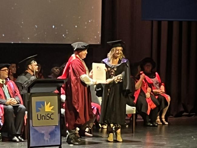 Graduates from the University of the Sunshine Coast's Fraser Coast campus celebrating at the Brolga Theatre.