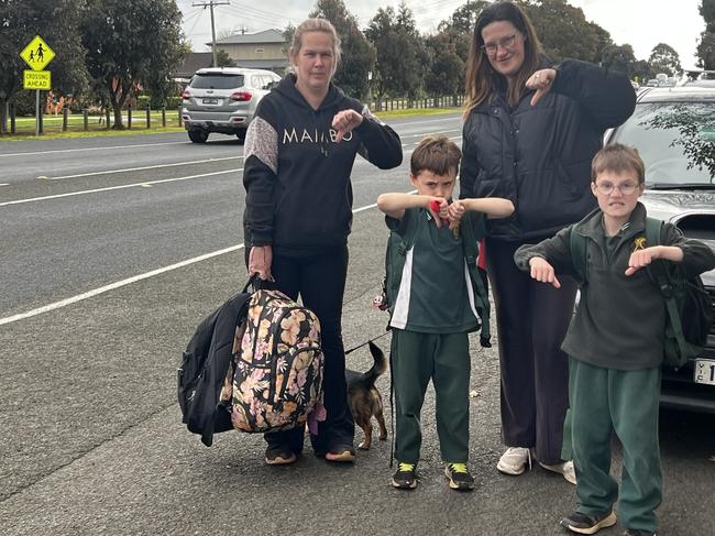 Jacque Telfer and Jessica Goulding and her two kids Flynn and Logan are “frustrated” with how “chaotic” Nerrena Rd can get during school pick up. Picture: Jack Colantuono