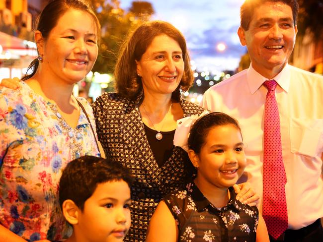 Melissa and children Maxme, 6, and Jahzara, 8, pose for photographs with Premier of New South Wales Gladys Berejiklian on Friday.