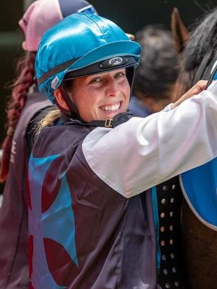 Apprentice jockey Chelsey Reynolds unsaddles after a winner. Picture: Makoto Kaneko