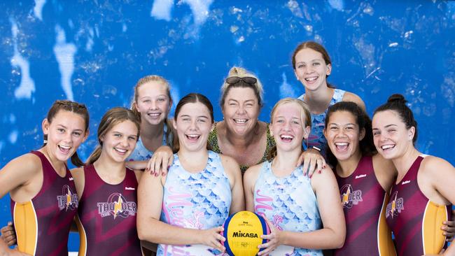 Mermaids Water polo club is the most successful junior club in Australia.  Sunday, March 17, 2019.  Coach of the Mermaids and assistant coach of the Qld thunder Nicola Johnson poses for a photograph in Yeronga with Kate Blew, Lara Owen, Louisa Downes,  Chelsea Johnson, Annabel Cowan, Josephine Crimmins, Matilda Elliott and Kasey Dalziel. (AAP Image/Renae Droop)