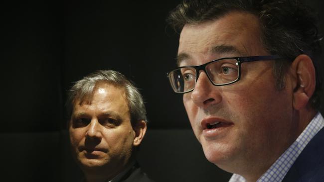 Victorian Chief Health Officer Brett Sutton (L) looks on as Victorian Premier Daniel Andrews (R) speaks to the media during a press conference in Melbourne, Victoria. Picture: NCA NewsWire / Daniel Pockett