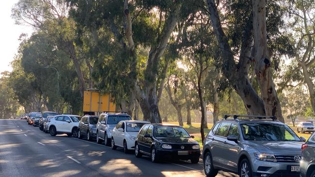 People are turning out in droves to coronavirus testing clinics across the city on Tuesday, including huge lines at Victoria Park. Picture: Emma Brasier