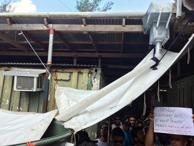 Rain catchment systems have been rigged up in the centre after water was cut off. Picture: AFP photo/ Nick McKim