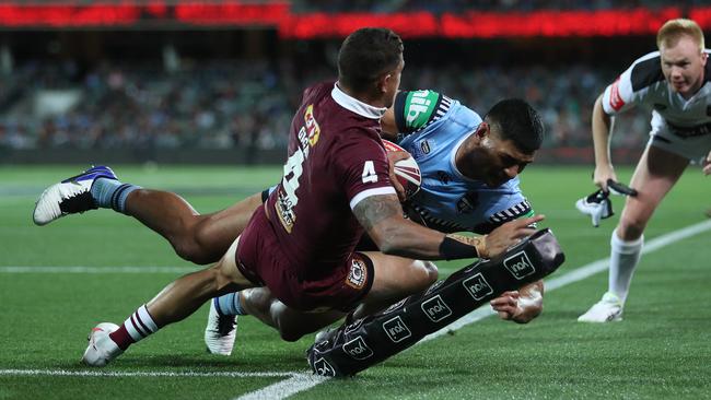 Dane Gagai makes a try saving tackle. Picture: Brett Costello