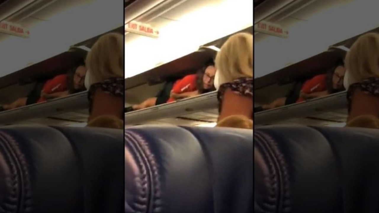 Southwest Airlines Flight Attendant Takes Break Inside Overhead