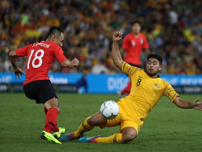 BRISBANE, AUSTRALIA - NOVEMBER 17: Massimo Luongo of Australia is challenged by Moon Seonmin of Korea Republic  during the International Friendly match between the Australian Socceroos and Korea Republic at Suncorp Stadium on November 17, 2018 in Brisbane, Australia. (Photo by Robert Cianflone/Getty Images)