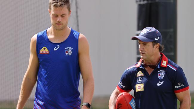 Luke Beveridge talks to Josh Schache. Chris Grant has challenged the young forward to get physical.