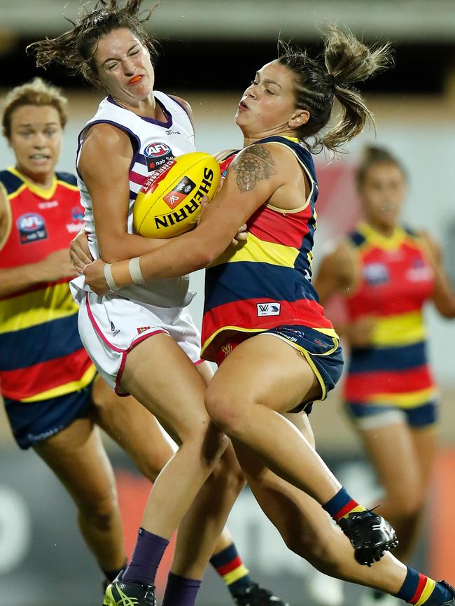 Crows tall midfielder Anne Hatchard comes up against Dockers’ Philipa Seth during Adelaide’s win at TIO Stadium in Darwin. Hatchard is in career-best form and must be pushing for All-Australian selection. Picture: Michael Willson/AFL Media