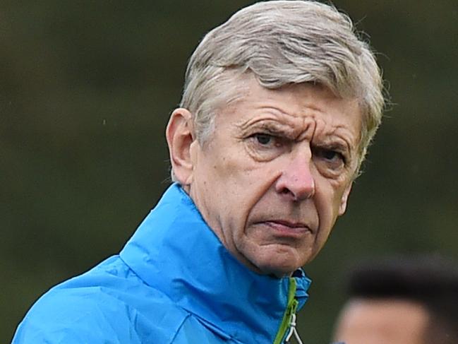 Arsenal manager Arsene Wenger gestures during an Arsenal training session at the London Colney training ground north of London on November 25, 2014, ahead of their UEFA Champions League Group D match against Borussia Dortmund in London. AFP PHOTO / BEN STANSALL