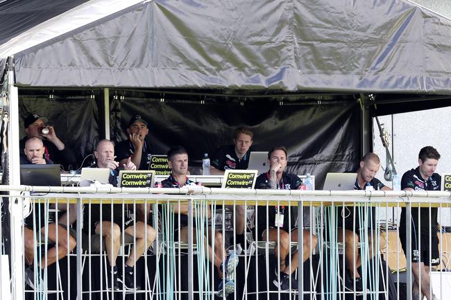 Port Adelaide coaching panel sit on the balcony of the clubs’ headquarters for the North Melbourne game at Alberton Oval. Picture Sarah Reed