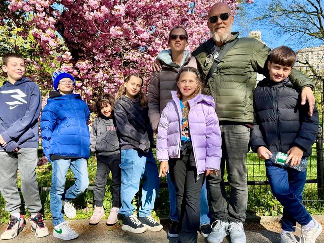 Abigail with her two siblings, her aunt and uncle who have adopted them and their three biological children. Picture: Supplied.