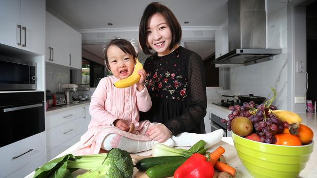 Deakin University researcher Dr Miaobing Zheng, with two-year-old daughter Mia, is investigating the diets of toddlers. Picture: Rebecca Michael