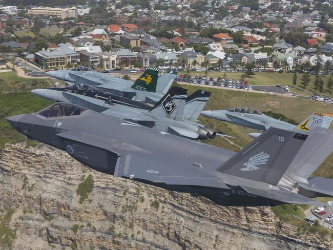 Royal Australian Air Force F/A-18 Hornets fly in formation with an F-35A Joint Strike Fighter over Newcastle, NSW. *** Local Caption *** The Minister for Defence, the Hon Christopher Pyne MP, accompanied by the Governor General of the Commonwealth of Australia, His Excellency General Sir Peter Cosgrove AK MC (retd), Governor of NSW, His Excellency General the Honourable David Hurley AC DSC (retd), Minister for Defence Industry, the Honourable Steven Ciobo, MP, Assistant Minister for Defence, Senator the Honourable David Fawcett, Shadow Minister for Defence, The Honourable Richard Marles MP, Chief of Defence Force, General Angus Campbell AO DSC, and Chief of Air Force, Air Marshal Gavin Davies, AO, CSC welcomed Australia’s first two F-35A aircraft into Australia on 10 December 2018.    The Australian Defence Force (ADF) was proud to showcase the first two F35A Joint Strike Fighter aircraft of the Royal Australian Air Force Fleet.  Royal Australian Air Force pilots and maintenance personnel are embedded within United States Air Force units and partnering with Lockheed Martin in preparation for the introduction of Australia’s first fifth-generation air combat capability.   The F-35A Joint Strike Fighter is the most advanced, affordable fifth generation multi-role stealth fighter to meet Australia’s need to defeat emerging threats well into the future. The F-35A is truly next-generation due to its stealth capability, advanced sensors, data fusion and its ability to share information with other aircraft, Army units and Navy ships. The Australian Government has approved the purchase of 72 F-35A aircraft to replace F/A18A/B Hornets. The F-35A aircraft will be operated by the Air Force’s Number 3 Squadron, part of the Air Combat Group at RAAF Base Williamtown.