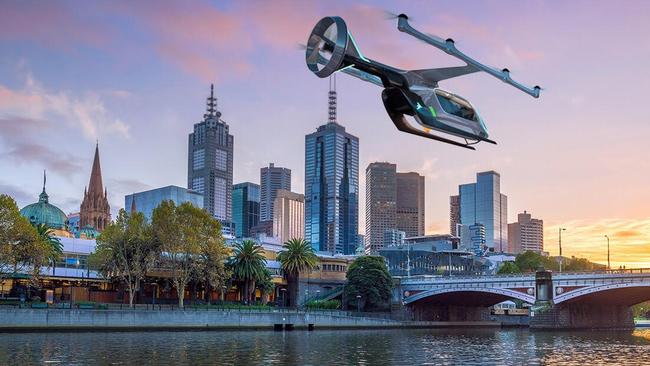 An Uber Air EmbraerX prototype aircraft flying over Melbourne