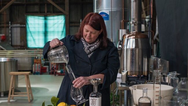 Sparkling wine and gin maker Natalie Fryar of Bellebone and Abel Gin Co, a co-production with Kim Seagram, pictured at her Launceston distillery with a botanical still named Genevieve. Picture: CHRIS CRERAR