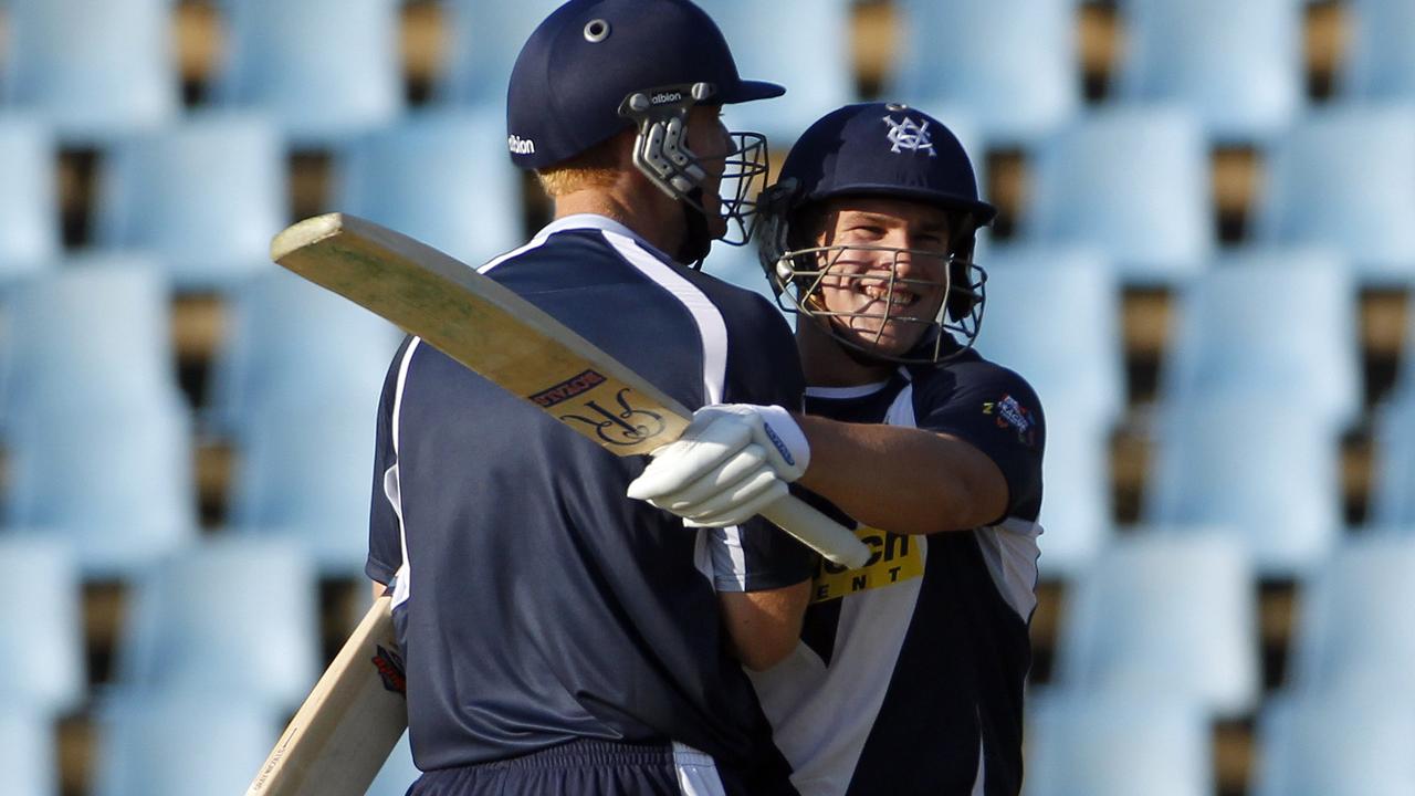 Andrew McDonald and Aaron Finch celebrate a win for Victoria.