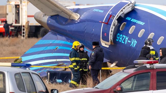 Emergency specialists work at the crash site of an Azerbaijan Airlines passenger jet near the western Kazakh city of Aktau. Picture: AFP