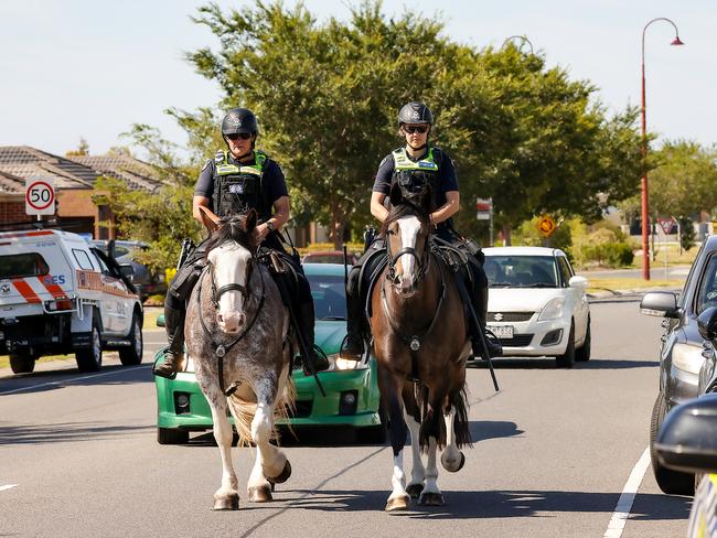 Police patrol the area after the incident. Picture: Ian Currie